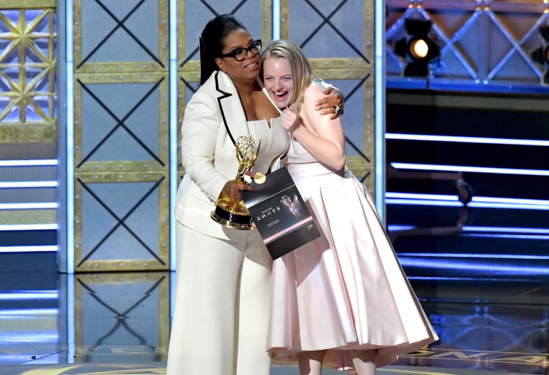 Oprah Winfrey  presents the outstanding lead actress in a drama series award for 'The Handmaid's Tale' to actor Elisabeth Moss.