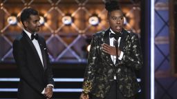 Aziz Ansari, left, and Lena Waithe accept the award for outstanding writing for a comedy series for the "Master of None" episode "Thanksgiving" at the 69th Primetime Emmy Awards on Sunday, Sept. 17, 2017, at the Microsoft Theater in Los Angeles. (Photo by Phil McCarten/Invision for the Television Academy/AP Images)