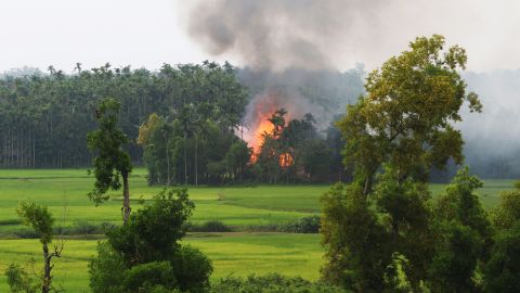 Smoke rises from what is believed to be a burning village in the southern Maungdaw area of Myanmar's Rakhine state on September 4, 2017.

