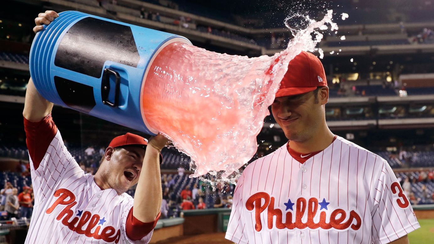 Philadelphia rookie Cameron Perkins is doused by teammate Tommy Joseph after the Phillies' 10-0 victory against Miami on Thursday, September 14. Perkins hit his first career home run during the game.