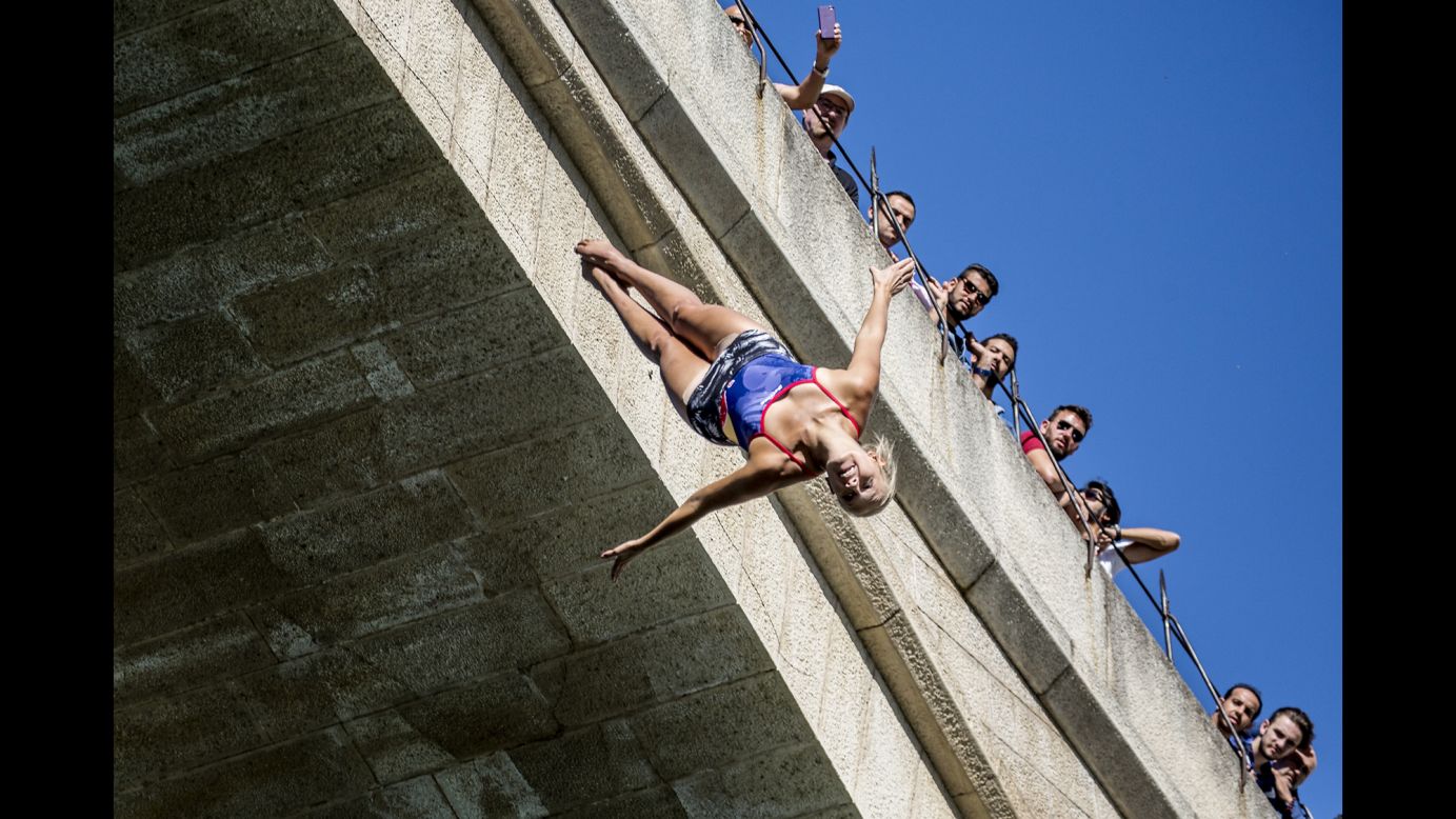 People watch high-diver Rhiannan Iffland train in Mostar, Bosnia-Herzegovina, on Thursday, September 14. Mostar was the latest stop of the Red Bull Cliff Diving World Series.