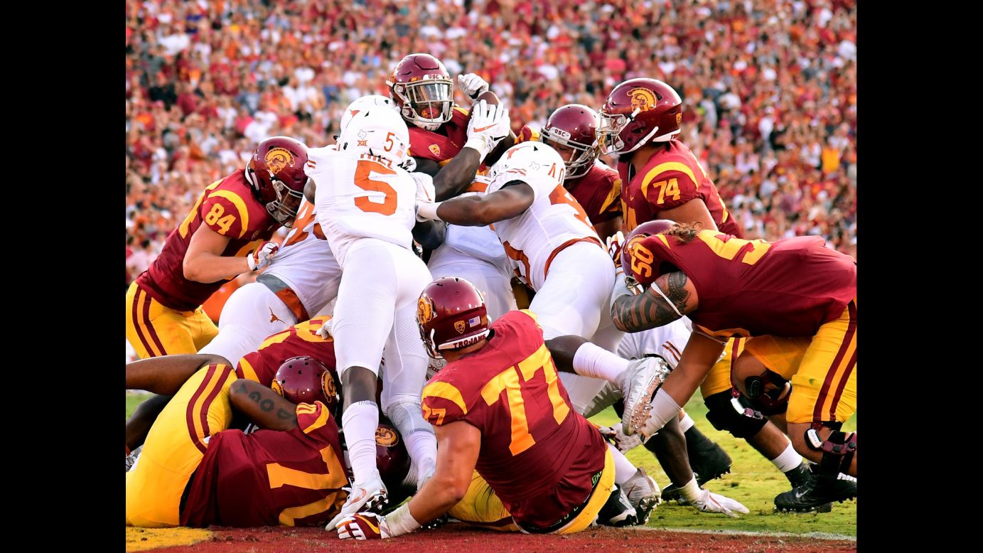 USC running back Ronald Jones II, top, is stuffed at the goal line by Texas defenders on Saturday, September 16. In what was a rematch of the legendary 2006 Rose Bowl, USC escaped with a 27-24 victory in double overtime.