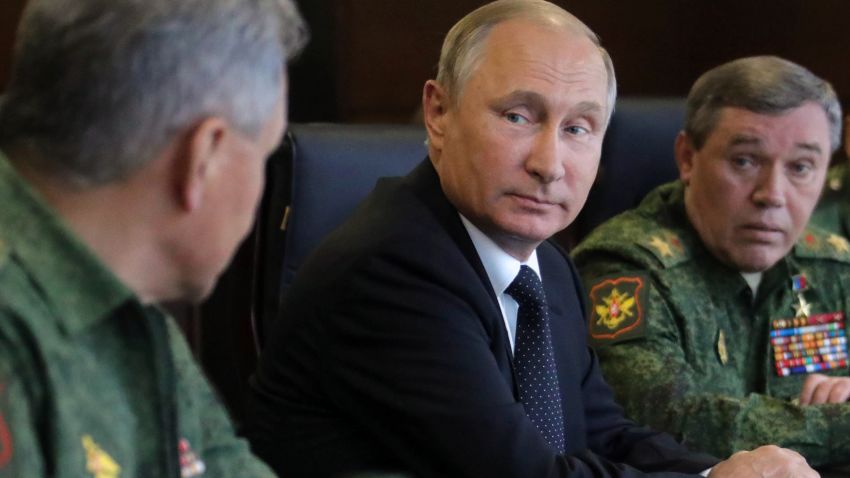 Russian President Vladimir Putin (C), accompanied by Defence Minister Sergei Shoigu (L) and Chief of the General Staff Valery Gerasimov (R), watches the joint Zapad-2017 (West-2017) Russian military exercises with Belarus at the Luzhsky training ground in the Leningrad region on September 18, 2017. / AFP PHOTO / SPUTNIK / Mikhail KLIMENTYEV        (Photo credit should read MIKHAIL KLIMENTYEV/AFP/Getty Images)