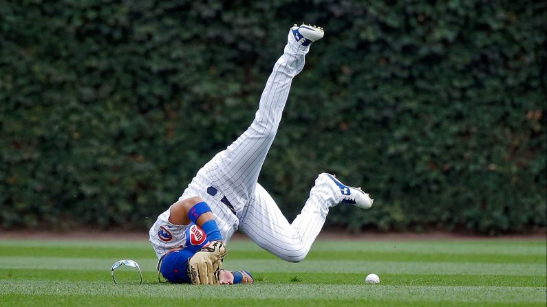 Chicago Cubs outfielder Albert Almora Jr. crashes into the ground as he tries to make a diving catch against St. Louis on Sunday, September 17.