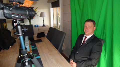 Chris Shortis films videos against a green screen in his home outside Melbourne that he posts to the internet.
