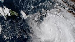 This Monday, Sept. 18, 2017, GOES East satellite image provided by NASA taken at 20:30 UTC, shows the eye of Hurricane Maria as it nears Dominica. The National Hurricane Center in Miami said Monday evening that Air Force Reserve hurricane hunter planes found that Maria had strengthened into a storm with 160 mph (260 kph) winds. (NASA via AP)