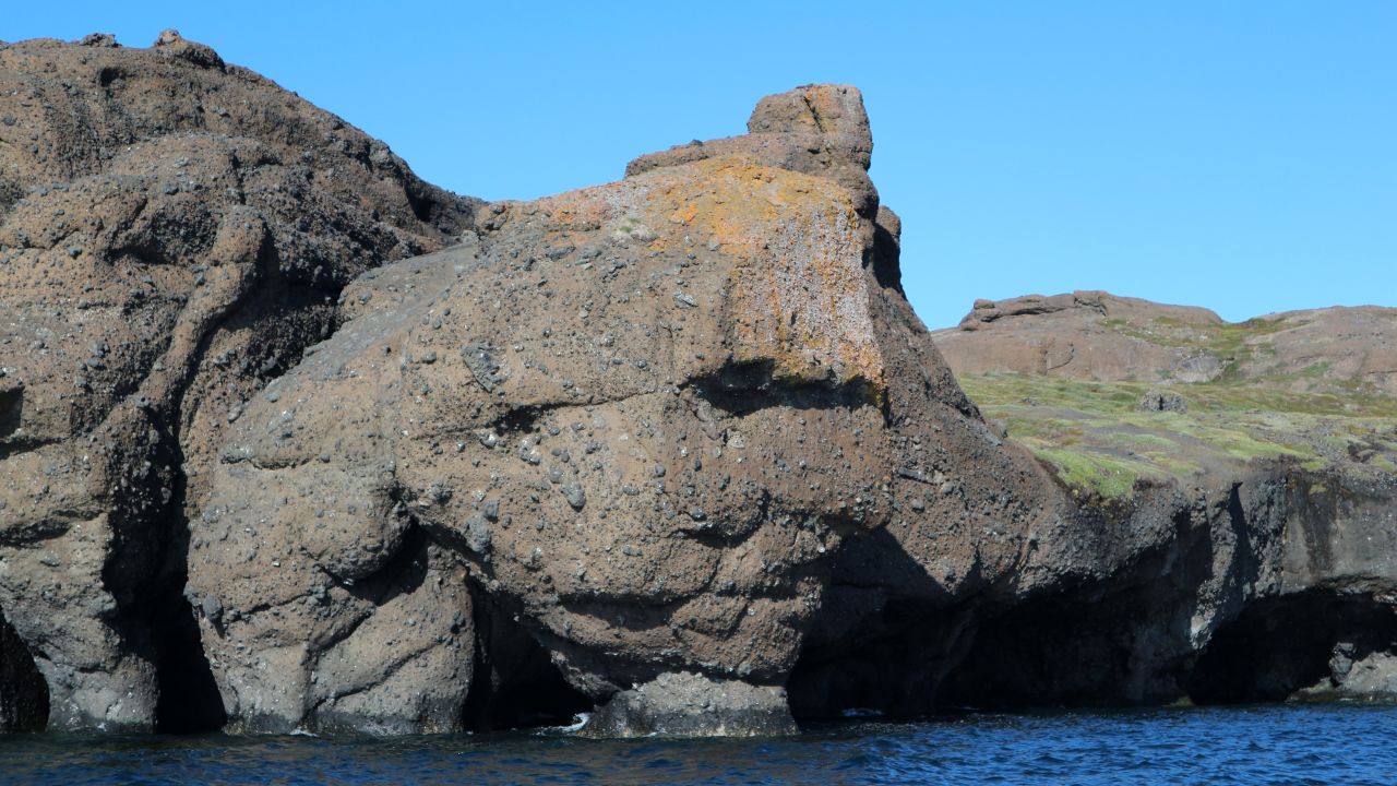 A huge stone resembling the famous stone heads on Easter Island is just one of the oddities that can be found exploring Disko's coastline.