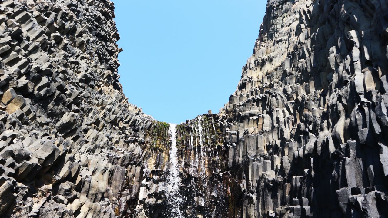 The basalt columns look completely unnatural despite being naturally formed. "They look like LEGO," says our guide Mark Mølgaard. "Like someone has cut them into layers."