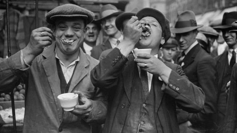 <strong>Local fare: </strong>Traditional East End pie and mash shops, serving fare such as pie, liquor and jellied eels -- pictured -- are now a dying breed. But if you're ready for some jelly, you can still sample it at F. Cooke on Hoxton Street, established 1862. <br /><br />Two men enjoy jellied eels in a Whitechapel street on a Sunday morning.   (Photo by Fox Photos/Getty Images)