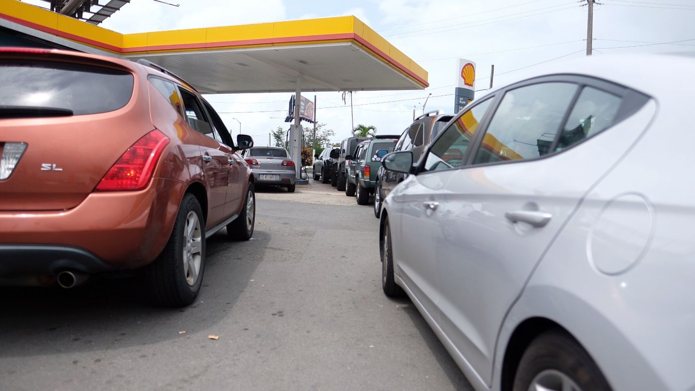 Cars line up at a gas station in San Juan on September 19.