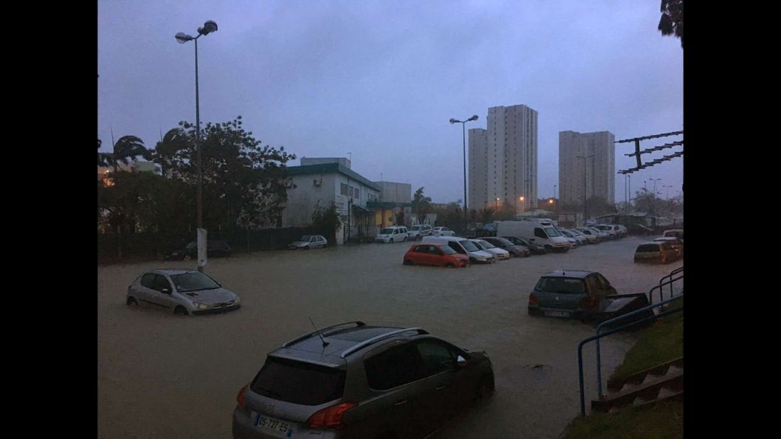 Floodwaters surround cars in Pointe-a-Pitre on September 19.