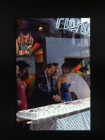 The man himself Elio Fiorucci cutting a cake in his store in Amsterdam. 