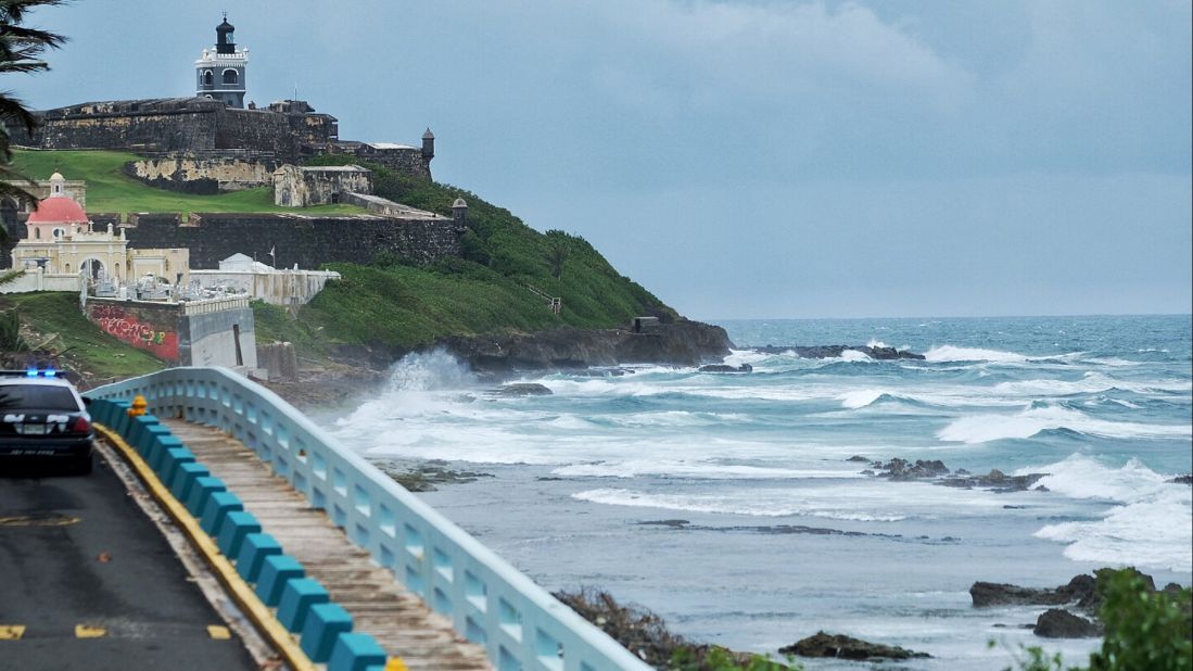 Waves crash in San Juan as the hurricane neared Puerto Rico on September 19.