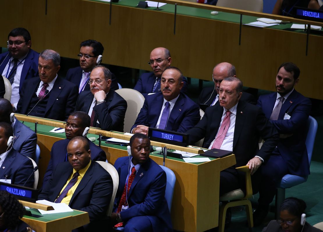 Turkey's President Recep Tayyip Erdogan (middle row R) and Deputy Prime Minister Recep Akdag (middle row 2 L) sit with other ministers during Trump's speech.