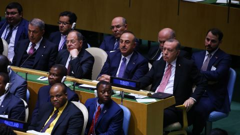 Turkey's President Recep Tayyip Erdogan (middle row R) and Deputy Prime Minister Recep Akdag (middle row 2 L) sit with other ministers during Trump's speech.