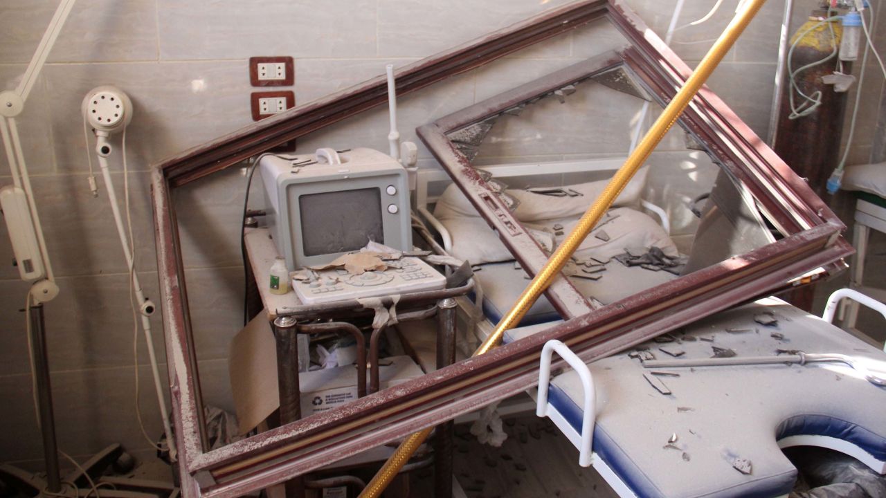 A hospital bed covered in rubble in Al-Tah village.