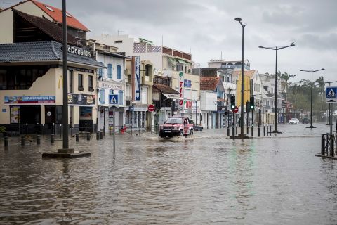 A motorist drives on the flooded waterfront in Fort-de-France, Martinique, on September 19.