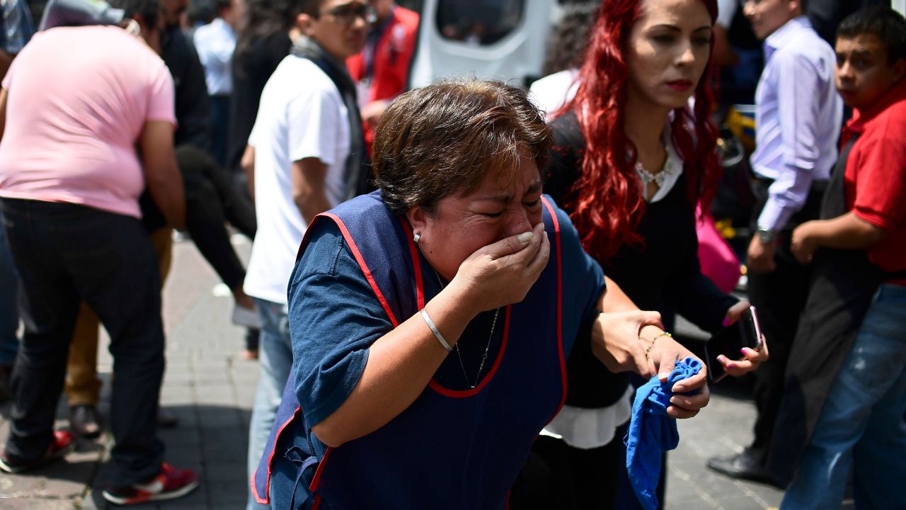A woman in Mexico City reacts after the quake.