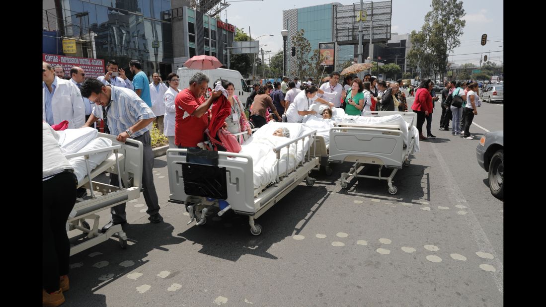 Patients from a Mexico City hospital receive treatment outside after the hospital was evacuated on September 19.