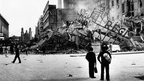 People inspect the damaged Hotel Regis after an earthquake, registering 7.8 on the Richter scale, hit Mexico City on Thursday, Sept. 19, 1985. 