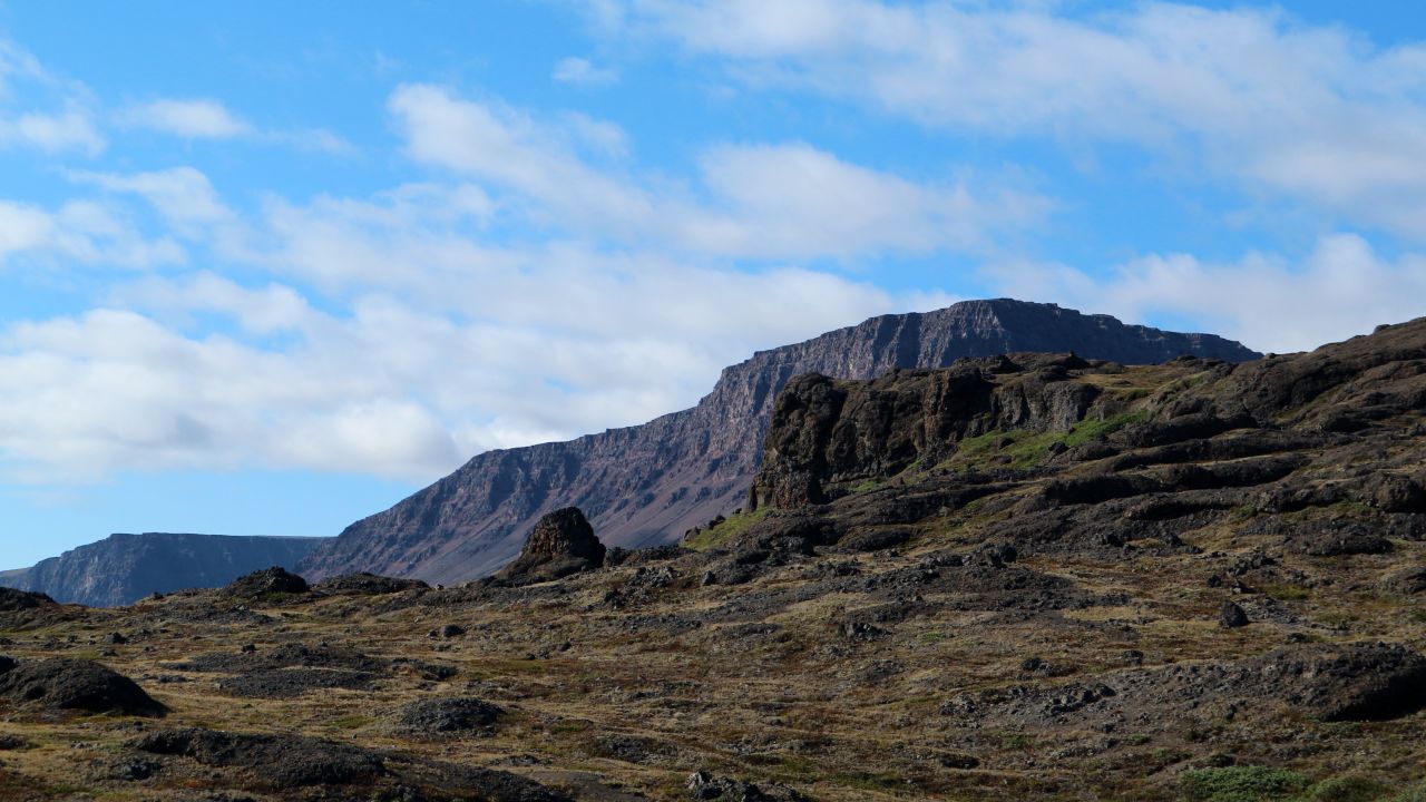 The stunning beauty of the red flattop mountains of Disko Island.