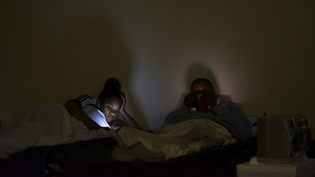 People take shelter at Puerto Rico's Humacao Arena on Tuesday, September 19.