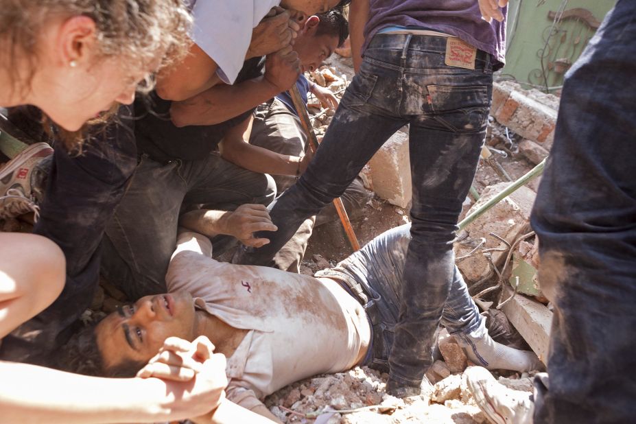 A man is rescued under rubble in Mexico City's Condesa area on September 19.