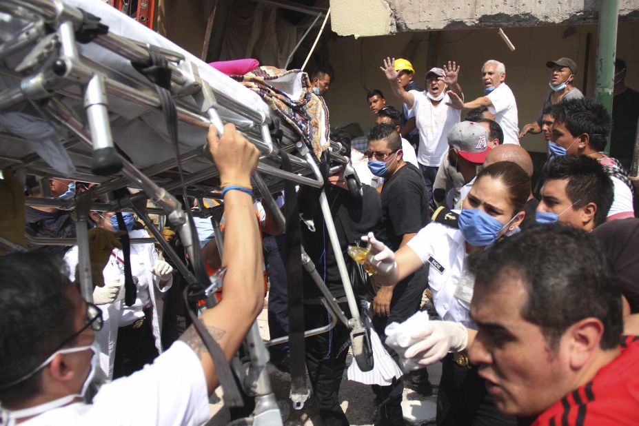 Rescue workers in Mexico City search for people trapped inside the collapsed Enrique Rebsamen school on September 19.