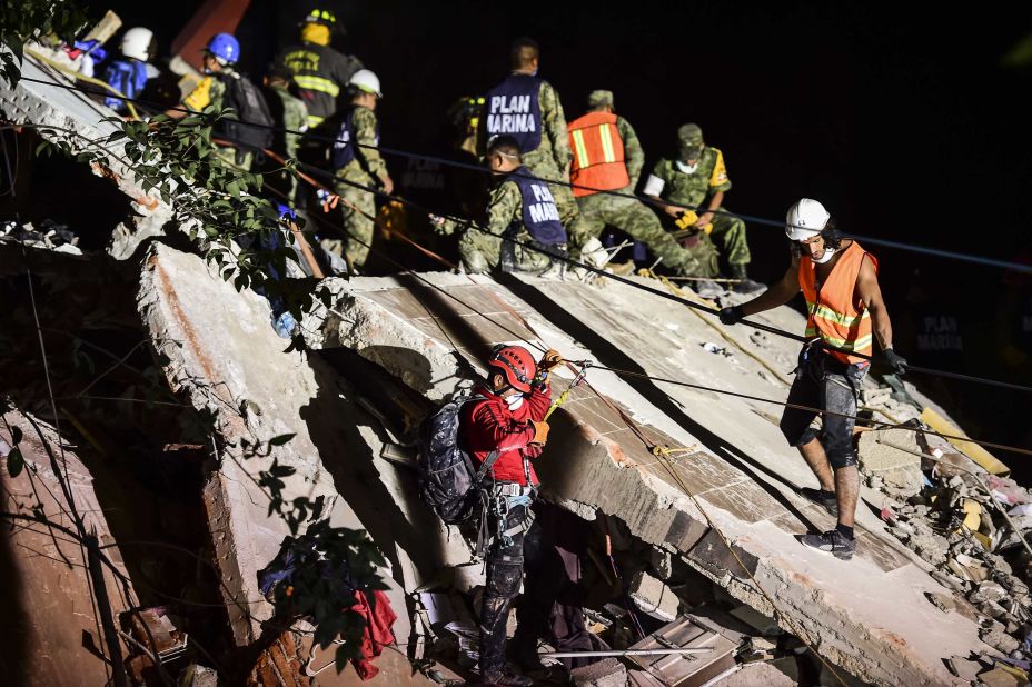 Rescue workers remove rubble from a Mexico City building on September 19.