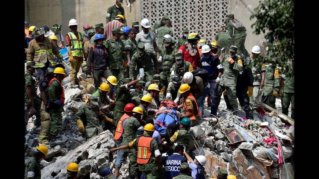 A survivor is pulled out of rubble in Mexico City on September 20.