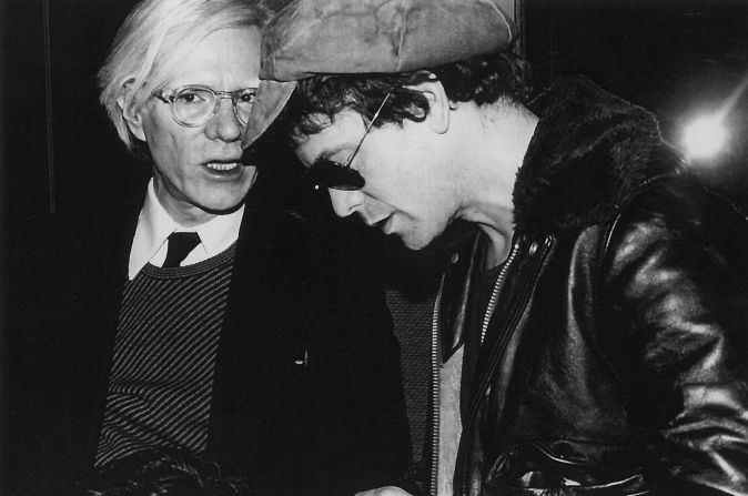 Andy Warhol shares a moment with Lou Reed. 