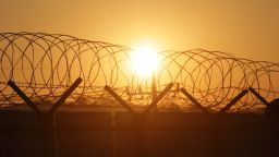 PAJU, SOUTH KOREA - JANUARY 08: A sunrise is seen through a barbed-wire fence at the Imjingak, near the Demilitarized zone (DMZ) separating South and North Korea on January 8, 2016 in Paju, South Korea. South Korea announced on January 7th that it would resume the broadcasts from loudspeakers placed along the border, criticizing the North in response to its nuclear test. In August, 2015, when South Korean soldiers were maimed by land mines in the DMZ, South Korea started the loudspeaker broadcasts and the North threatened to attack the speakers. (Photo by Chung Sung-Jun/Getty Images)