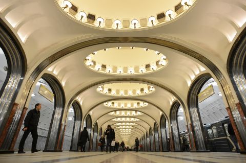 Subway passengers walk through Mayakovskaya  station in Moscow.