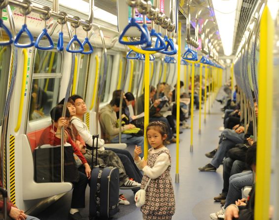 Passengers on a Mass Transit Rail (MTR) train in Hong Kong.