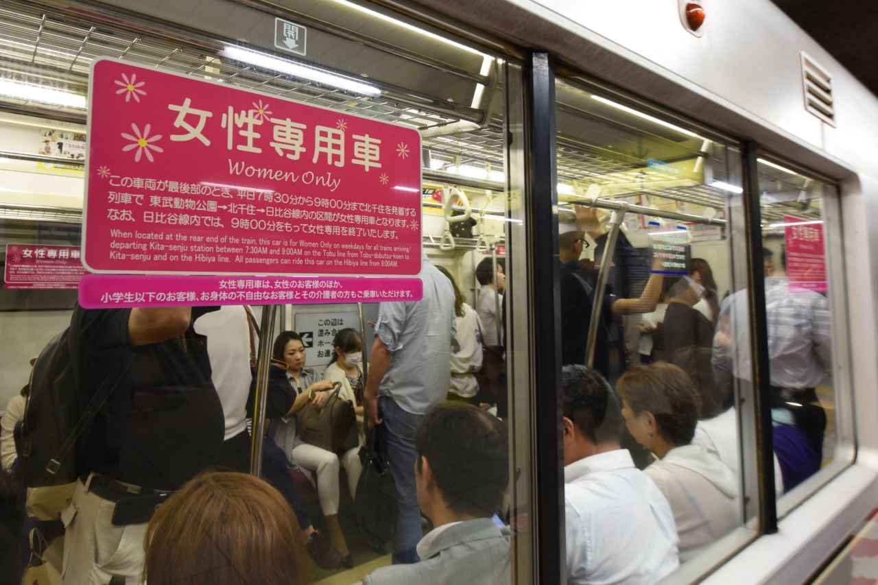 A poster informing commuters of a women's-only carriage is displayed on a subway train in Tokyo on June 2, 2017. 
