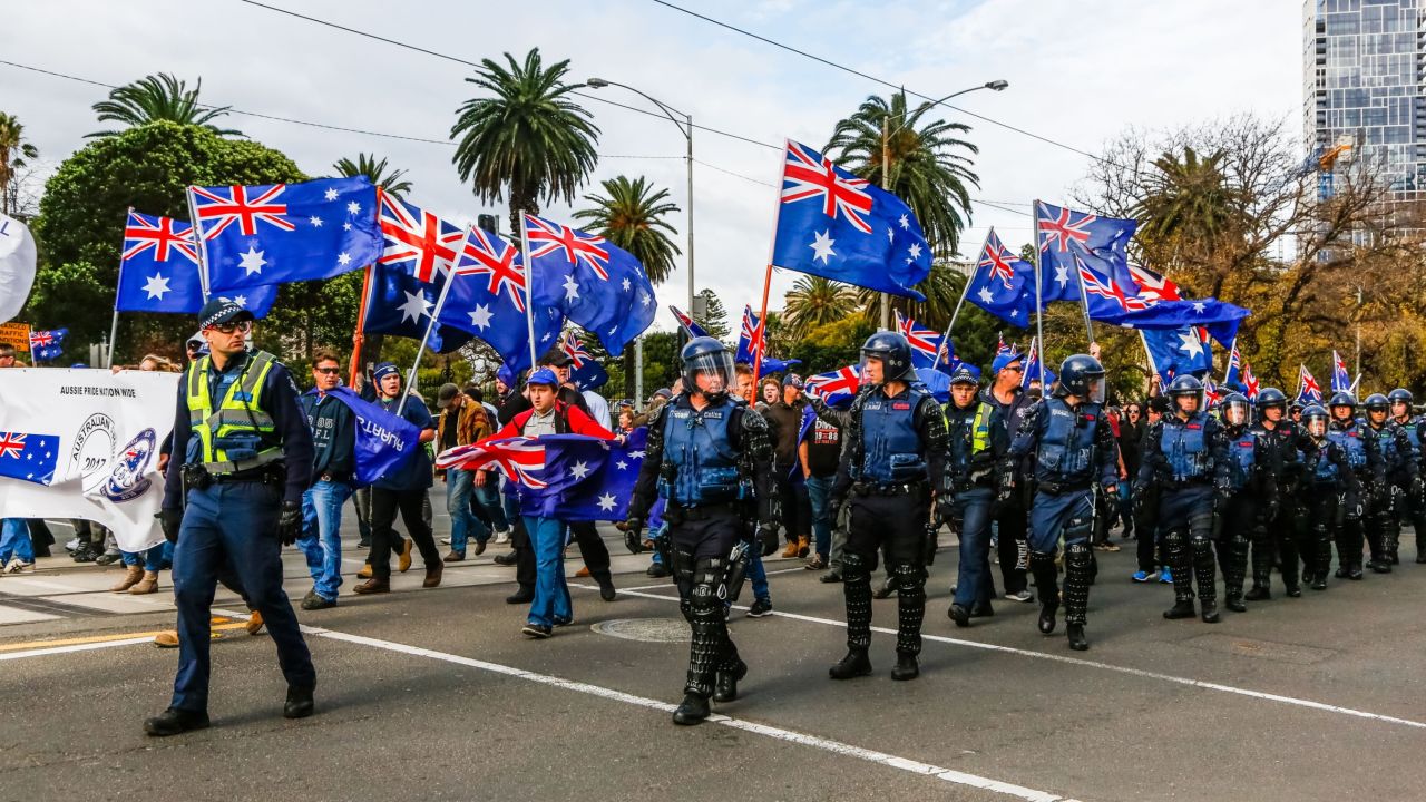 Police patrol as members of the right-wing nationalists the "True Blue Crew" march during a protest supported by the United Patriots Front, in Melbourne, Australia on June 25, 2017.