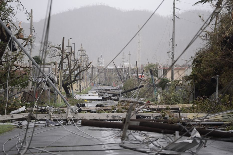Power lines are scattered across a road in Humacao, Puerto Rico, on September 20.