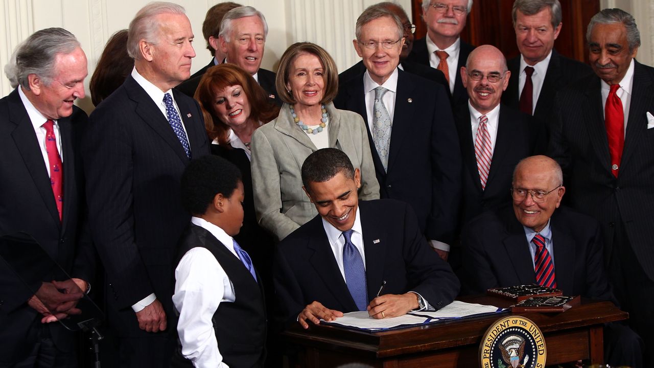 WASHINGTON - MARCH 23:  U.S. President Barack Obama (C) signs the Affordable Health Care for America Act during a ceremony with fellow Democrats in the East Room of the White House March 23, 2010 in Washington, DC. The historic bill was passed by the House of Representatives Sunday after a 14-month-long political battle that left the legislation without a single Republican vote.  (Photo by Win McNamee/Getty Images)