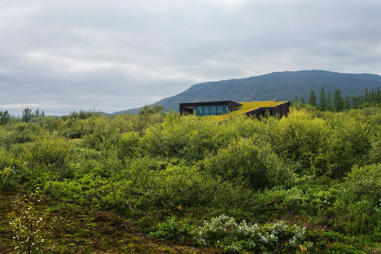 Vacation houses by PKdM Arkitektar present a modernized version of the traditional turf home.