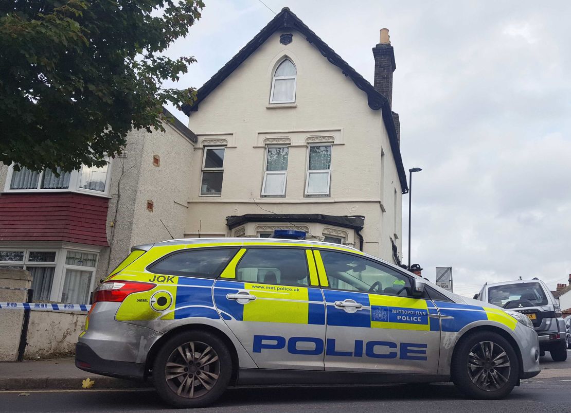Police are seen outside a property in Thornton Heath, south London, after a teenager was arrested by detectives investigating the Parsons Green terror attack.