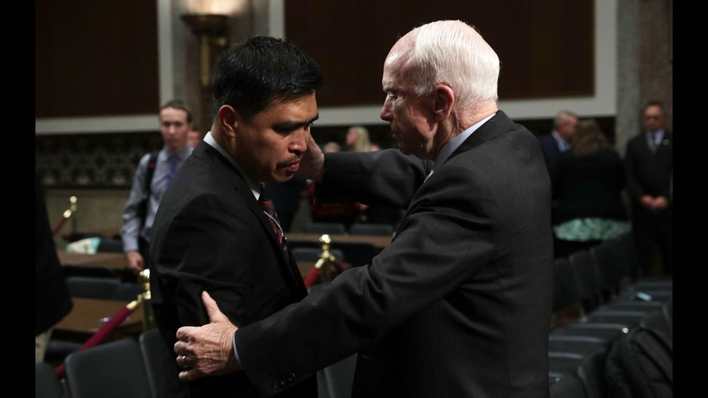 US Sen. John McCain tries to comfort Victor Sibayan after a hearing of the Senate Armed Services Committee on Tuesday, September 19. Sibayan's son Carlos was <a href="http://www.cnn.com/2017/06/19/politics/sailor-profiles-uss-fitzgerald/index.html" target="_blank">one of seven sailors killed in June</a> when the USS Fitzgerald collided with a container ship off the coast of Japan.