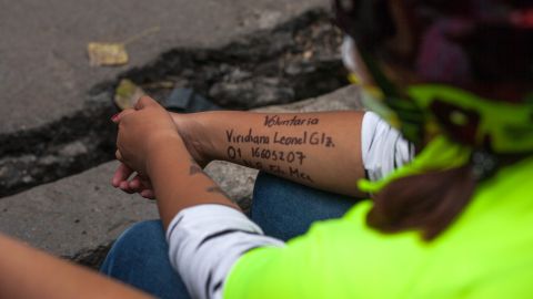 Many volunteers wrote their names, blood type, number and volunteer location written in permanent marker on their arms as an identification precaution before entering the rescue operation.