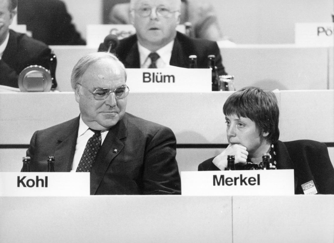 A younger Angela Merkel and then German Chancellor Helmut Kohl at a party convention in Dresden in 1991.