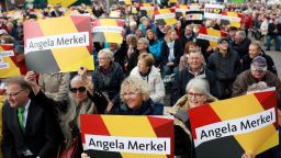 Supporters hold signs with the name of German Chancellor Angela Merkel before she addresses an election campaign rally of the Christian Democratic Union (CDU) in Kappeln, northern Germany on September 20, 2017, during the final days before Germans head to the polls. / AFP PHOTO / Odd ANDERSEN        (Photo credit should read ODD ANDERSEN/AFP/Getty Images)