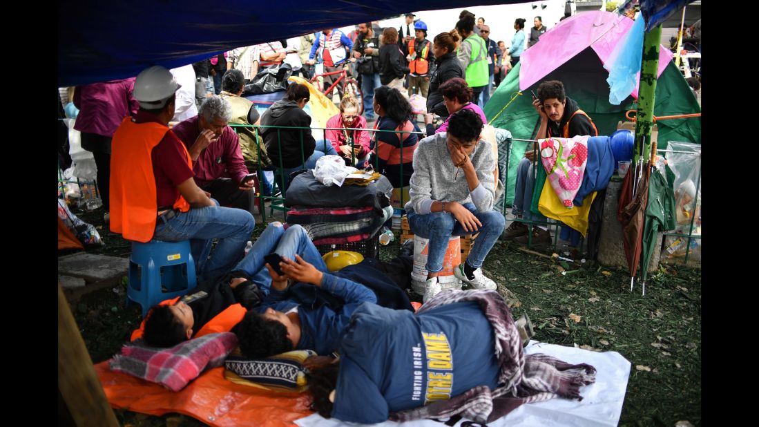 Relatives of missing people wait for news in front of a collapsed building in Mexico City on Friday, September 22. A magnitude 7.1 quake <a href="http://www.cnn.com/interactive/2017/09/world/mexico-quake-cnnphotos/" target="_blank">hit central Mexico</a> three days earlier.