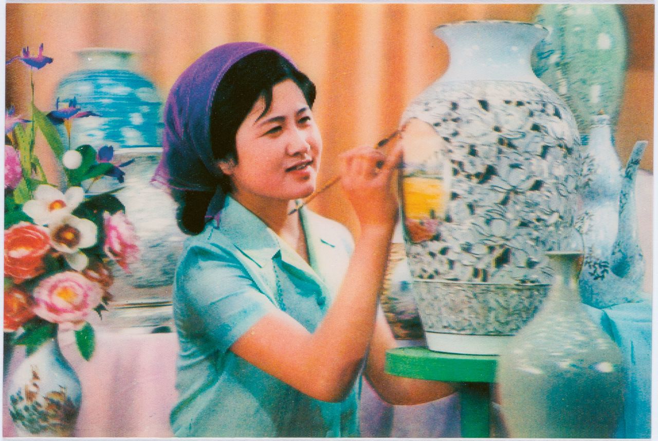 A postcard featuring a traditional North Korean artisan at work. 