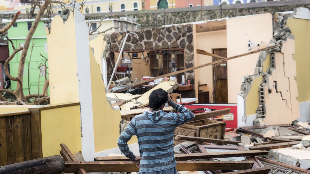 A resident of the La Perla neighborhood in San Juan, Puerto Rico, surveys the damage.