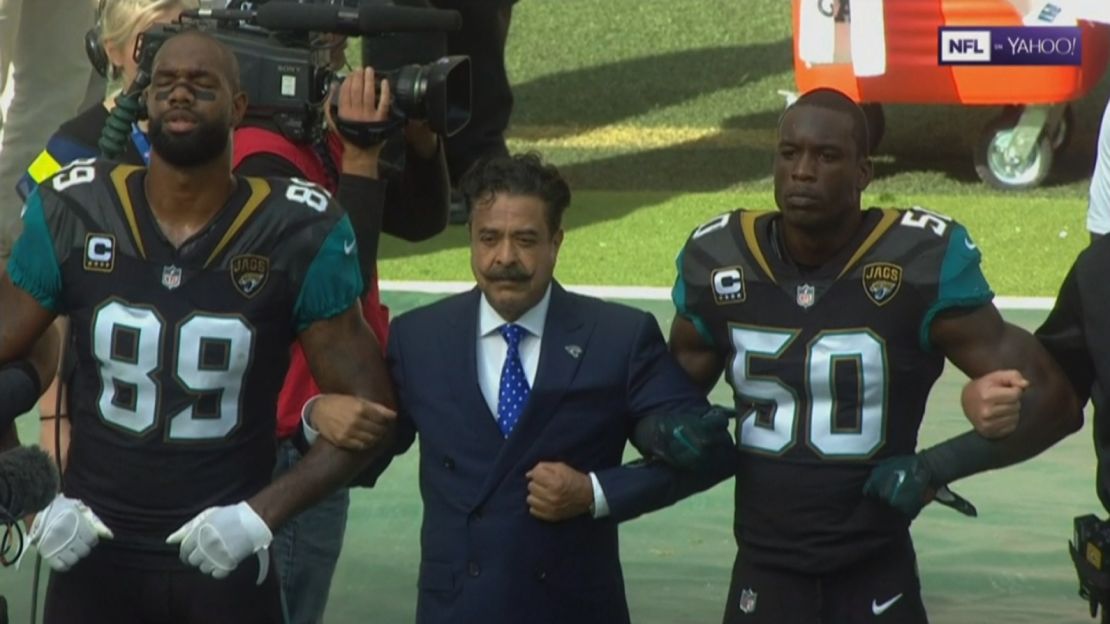 Team owner Shad Khan joined his players in protest Sunday. 