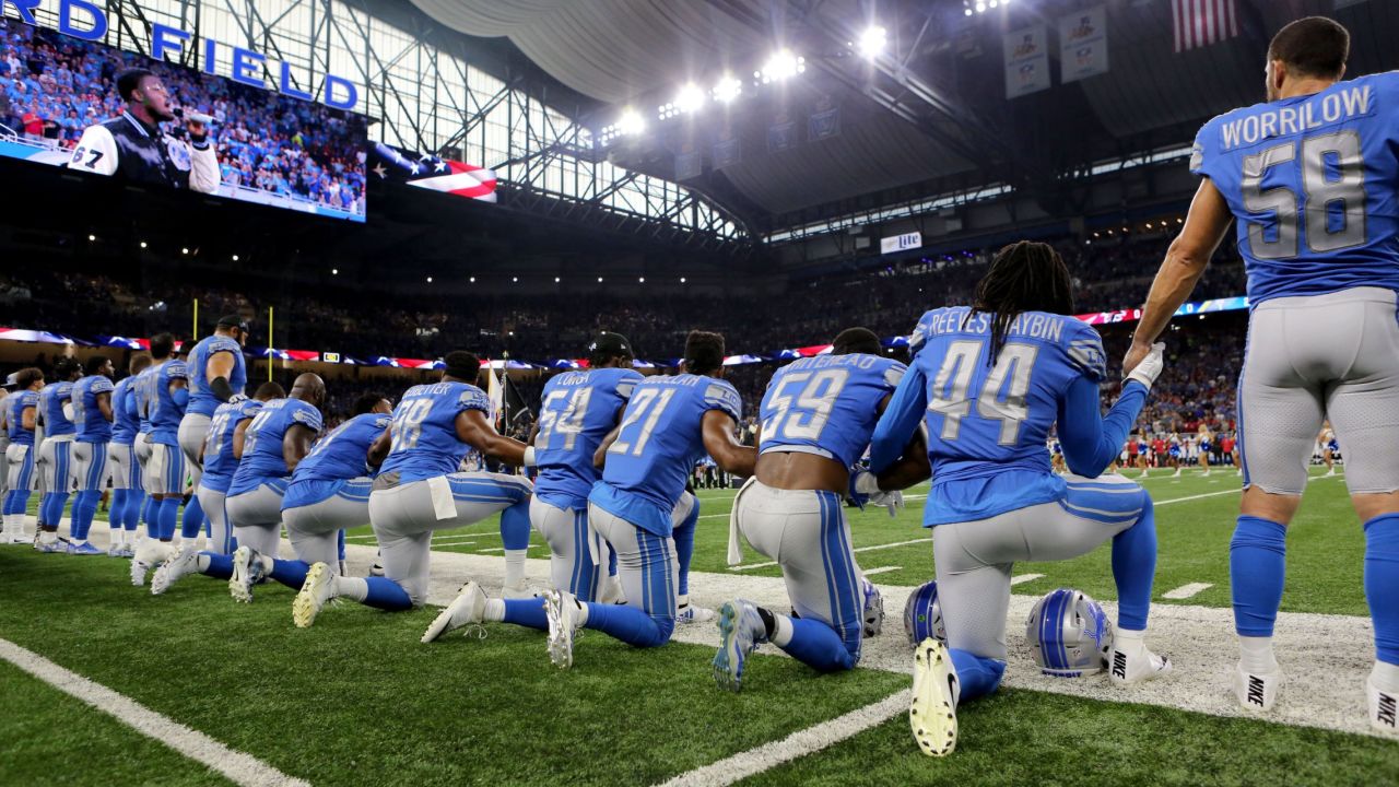 Members of the Detroit Lions take a knee during the National Anthem before their game against the Atlanta Falcons at Ford Field in Detroit.