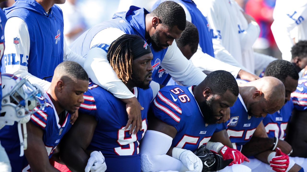 Buffalo Bills players kneel during the National Anthem before their game against the Denver Broncos at New Era Field in Orchard Park, New York.